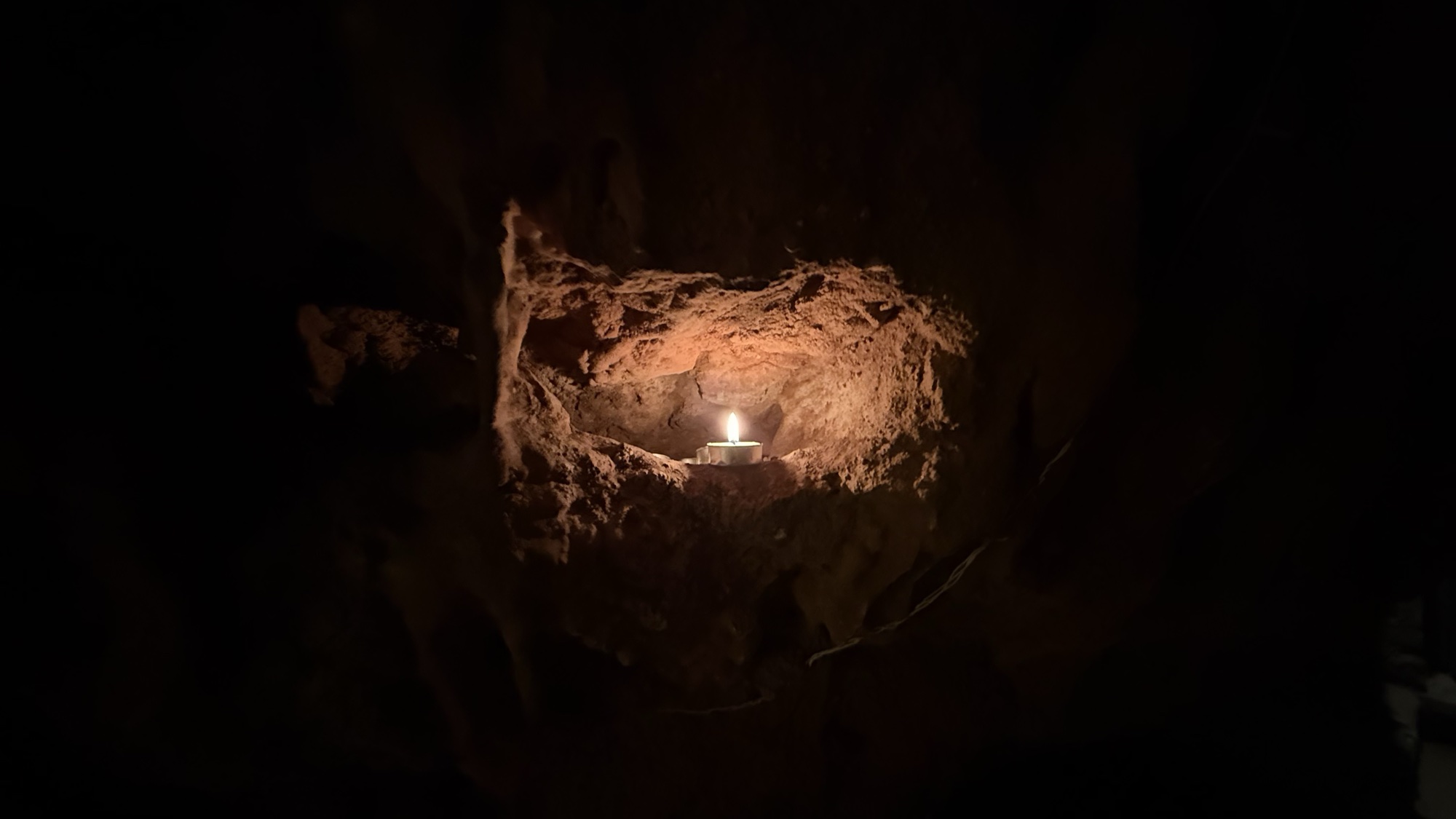 Candle glowing inside the sacred crystal cave